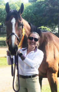 Ashley posing with her horse Bright